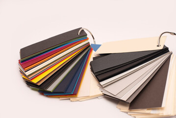 Samples of designer colored paper of different texture and thickness, selection of paper for...