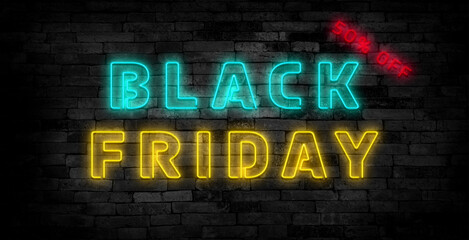Obraz premium Black friday sign emblem in neon style on brick wall background.