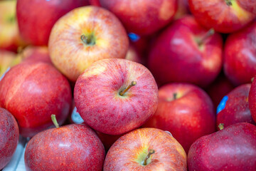 background of red apples in a store