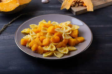Pasta with pumpkin. Vegetarian autumn dish.