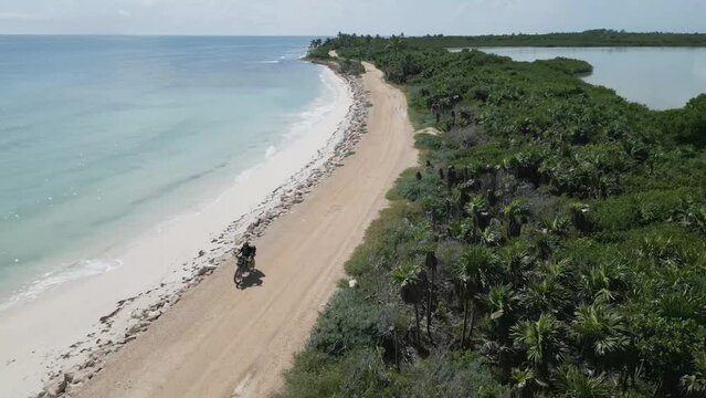 motorcycle driving off road in Tulum Biosphere Reserve Sian Ka'an Mexico 