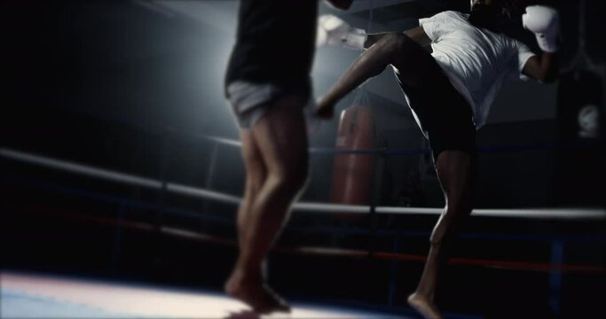 High-Speed Duel - Muay Thai opponent Unleash Fierce kick in 800 fps Slow-Motion. Fighter kicking rival inside boxing ring