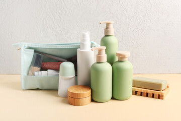 Set of different cosmetic products on color table