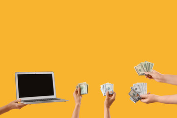 Women with laptop and dollar banknotes on yellow background