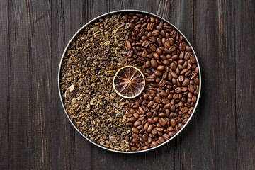 Green tea and coffee grains on a dark wooden background top view.
