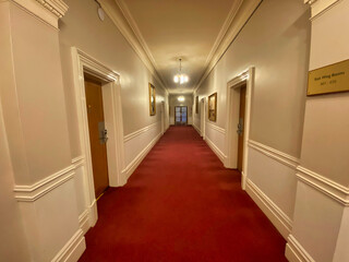 Hotel corridor with red carpet