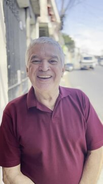 Grinning Gray-haired Gentleman, Laughter and Smiles in the Shade on Sunny Brazilian Sidewalk, Vehicles Passing By