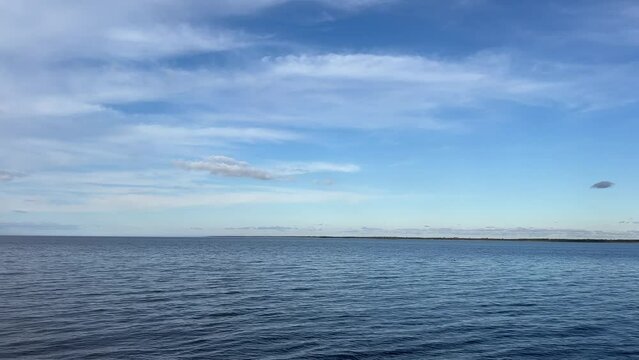 Blue sea and sky clouds.