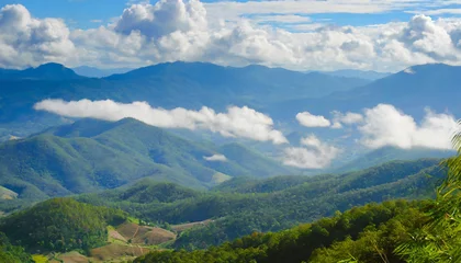 Papier Peint photo Bleu Jeans amazing wild nature view of layer of mountain forest landscape with cloudy sky natural green scenery of cloud and mountain slopes background maehongson thailand panorama view