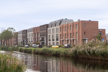 New modern residential buildings along the Laak river in the Vathorst district in Amersfoort.