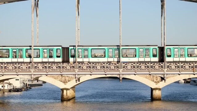 Train of Parisian subway (line 5) passing on Austerlitz viaduct over the river Seine in Paris