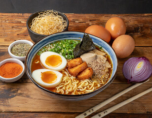 A bowl a Japanese food ramen along side with recipe ingredients