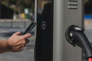 Anonymous person trying wireless EV charging connectivity