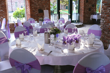 Beautiful wedding table set with purple decorations and lavender
