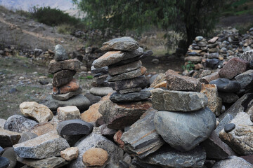 Balanced stone pyramid of archaeological site or tower of stacked stone or mountain stones. Stones arranged for meditation. Represent the spirit of Zem, Peru