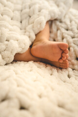 New Born Baby Feet on White Blanket