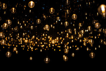 Gold Twinkle Christmas string lights on black background. - obrazy, fototapety, plakaty