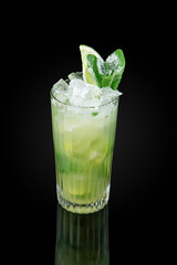 The Mojito. Alcoholic cocktail based on light rum and mint leaves. Glass on dark background with reflection