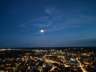 Fototapeta premium Aerial View of Illuminated British Downtown View of Luton City, England UK. Image Captured After sunset over United Kingdom with Drone's Camera