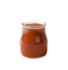 Red curry paste in glass jar isolated on white