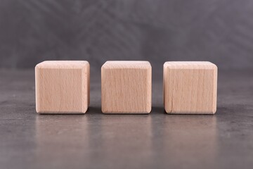 Wooden cubes with abbreviation ISO on grey textured table