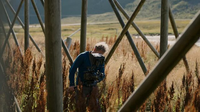 Professional Filmmaker Filming Stockfish Rack