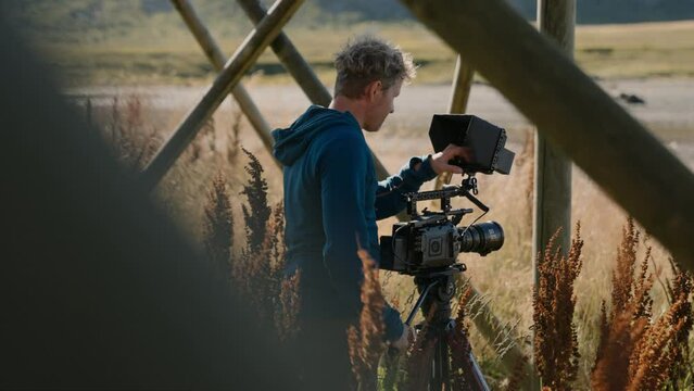 Man Touching The Camera's Smart Monitor
