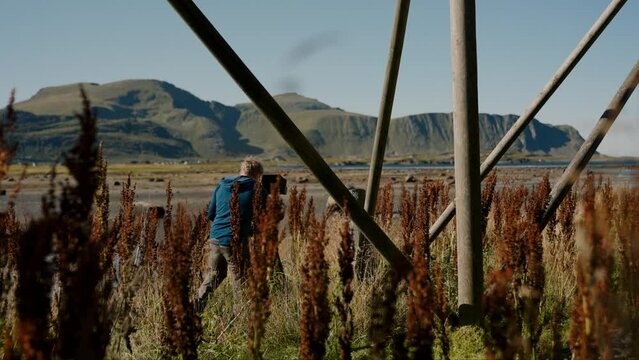 A Recording Filmmaker Near The Stockfish Rack