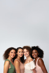 Obraz premium Diverse women with radiant complexions on a studio background, embodying wellness, empowerment, and makeup. Generative AI.