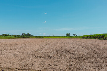 Preparing the soil for planting sugarcane in Thailand. - obrazy, fototapety, plakaty