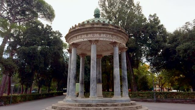 The temple of Diana, a decorative monopteros, located in villa borghese, a huge park in central Rome, Italy. This temple is at the center of a crossing of paths.