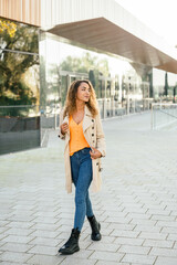Stylish woman walking on street