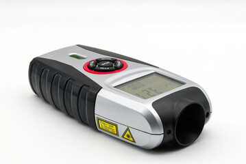 Ultrasonic distance meter isolated on white background. © Claudio Caridi