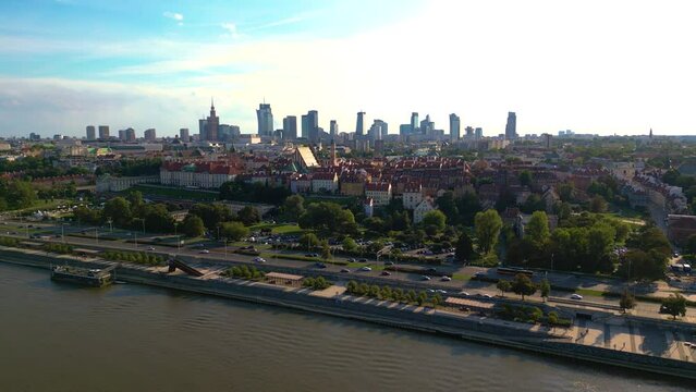 Aerial panorama of Warsaw, Poland over the Vistual river and City center in a distance Old town. Downtown skyscrapers cityscape. Business