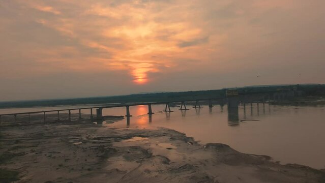 Pan shot of Chambal river and its old bridge in Dholpur during sunset time in Rajasthan India