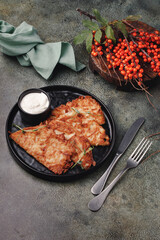 Potato pancakes served with sour cream