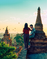 a couple visit Bagan Myanmar, Sunrise above temples and pagodas of Bagan Myanmar, Sunrise Pagan...