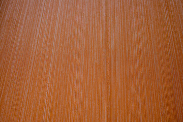 Orange background. The texture is decorative with a strip. Striped terracotta background