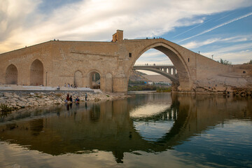 DIYARBAKIR, TURKEY, 08 OCTOBER 2023: The Malabadi Bridge is an arch bridge spanning the Batman...