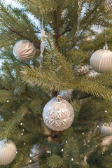 Obraz na płótnie Canvas Christmas tree with decor background in Merry winter white silver ball and green fir