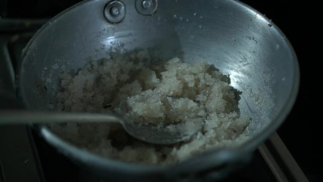 cooking video of making grated coconut balls sweet confectionary at home

