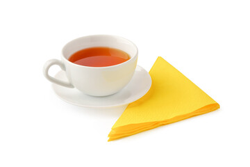 Cup of tea and paper napkin on white background