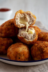 Homemade Cheesy Chicken Nuggets with Ketchup, side view. Close-up.