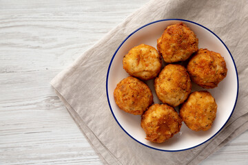 Homemade Cheesy Chicken Nuggets on a Plate, top view. Overhead, from above, flat lay. Copy space.