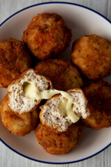 Homemade Cheesy Chicken Nuggets on a Plate, top view. Overhead, from above, flat lay.