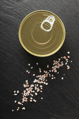 canned beef meat on the black background close up space for text