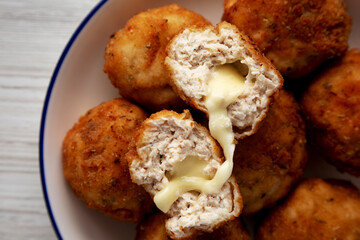 Homemade Cheesy Chicken Nuggets on a Plate, top view.