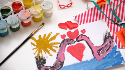 Child painting couple swan, hearts, making crafts from paper. Handmade concept for birthday, mothers day or Valentines day. Education. Inspiration and imagination - Powered by Adobe