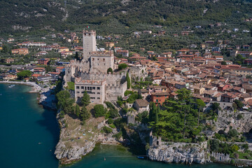 Fototapeta na wymiar Malcesine and Lago di Garda aerial view, Veneto region of Italy. Malcesine is a small town on the shore of Lake Garda in Verona province, Italy.