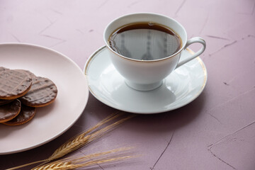 cup of coffee with cookies